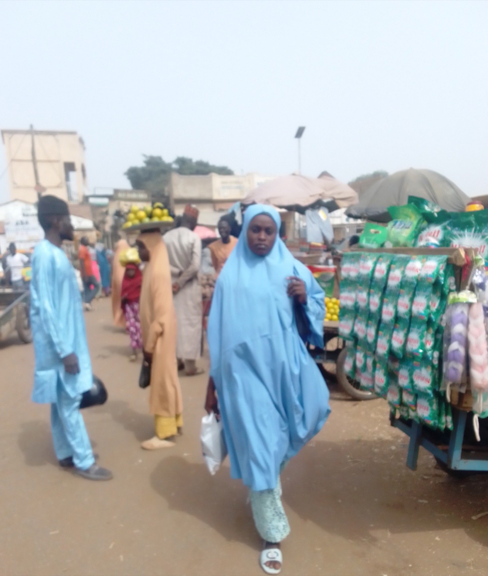 A woman trading at a market stall